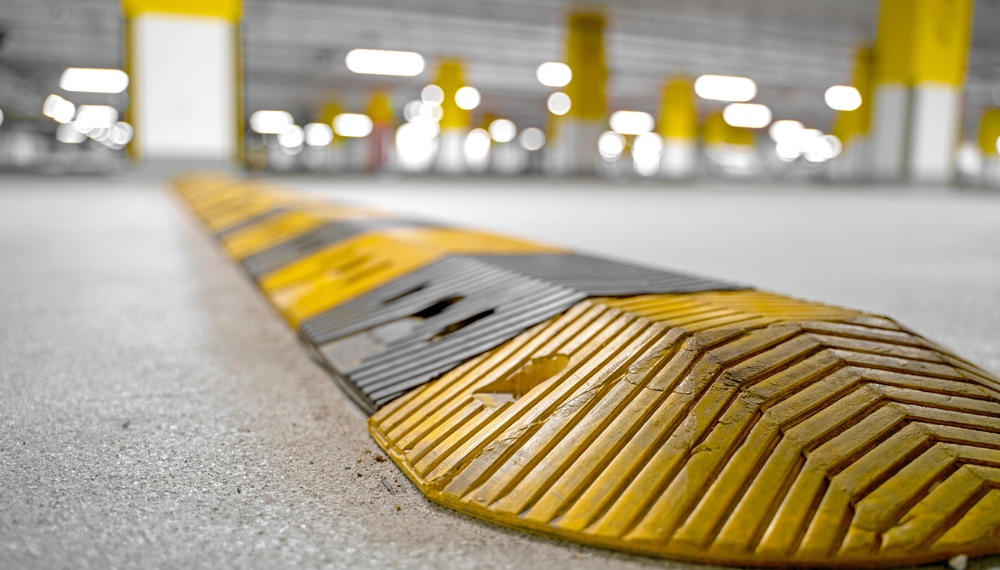 Yellow and black speed hump installed in an indoor car park